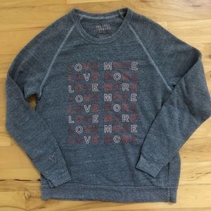 The Shop Forward “Love More”Sweatshirt.